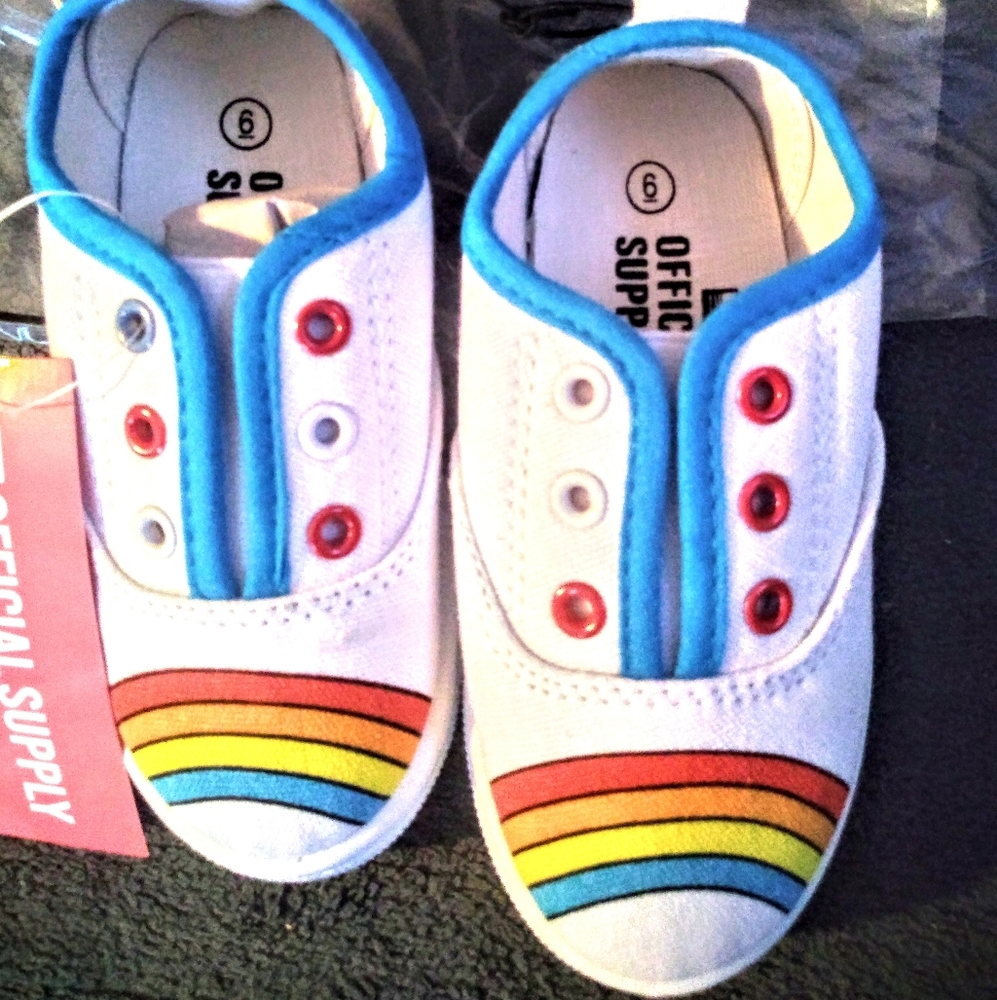 Little girls rainbow canvas sneakers.